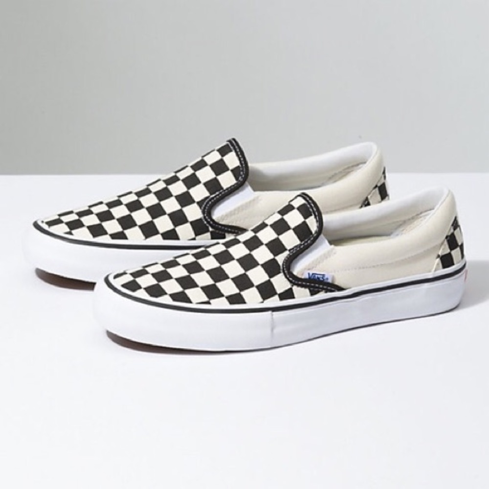 Black & white checkered slip-on Vans